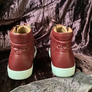 Steve Madden double zippered sneakers.